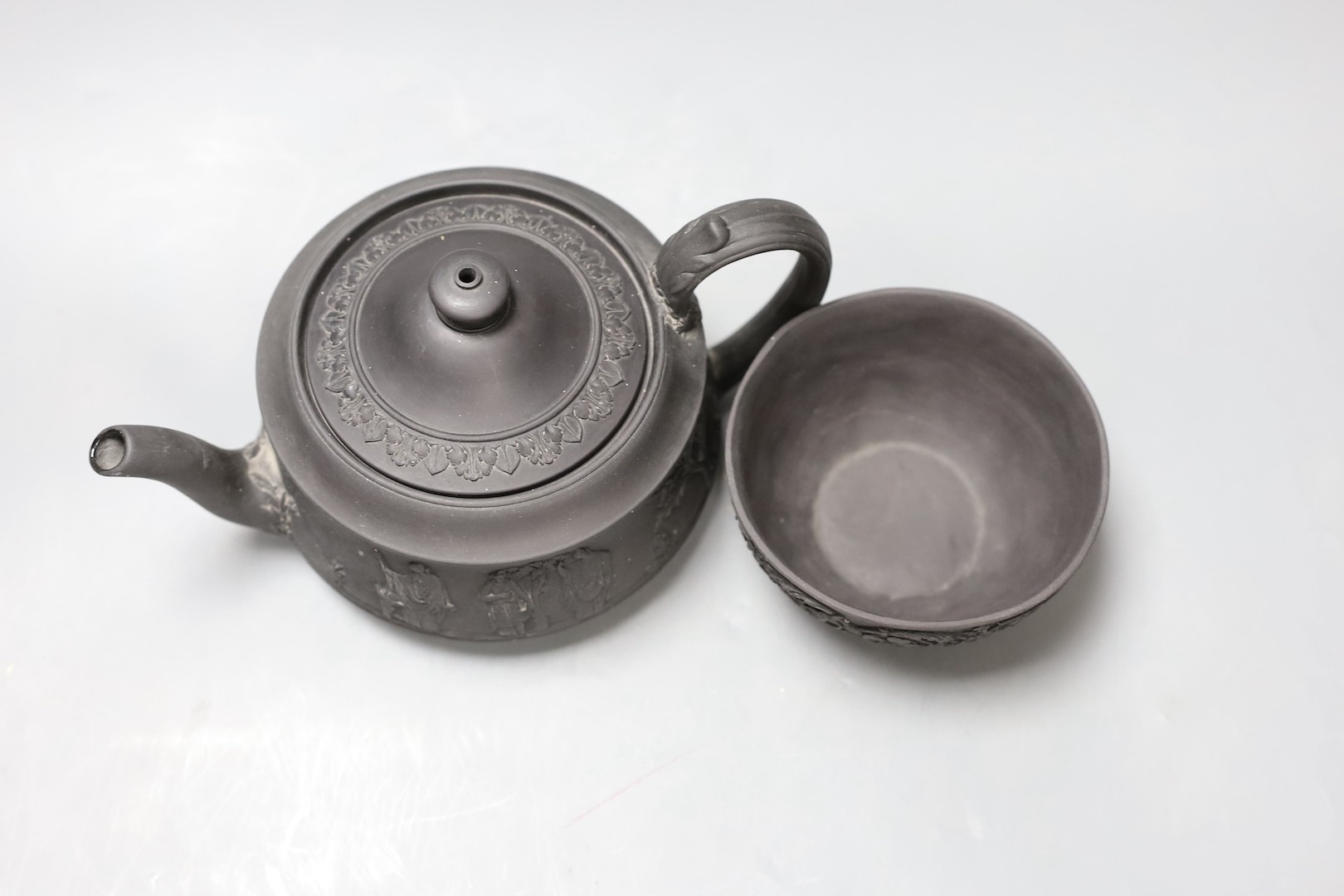 A Wedgwood black basalt 'Union' sugar bowl, early 19th century and a teapot and cover 10cm tall